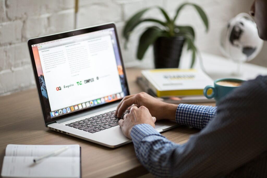 Man on laptop computer sitting at desk